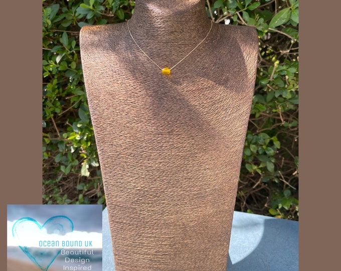 9 ct Solid Gold. Greek Honey. Genuine Yellow Sea Glass Bead on a floating Necklace. With a Hint of a Heart Imprint. Guaranteed Authentic.