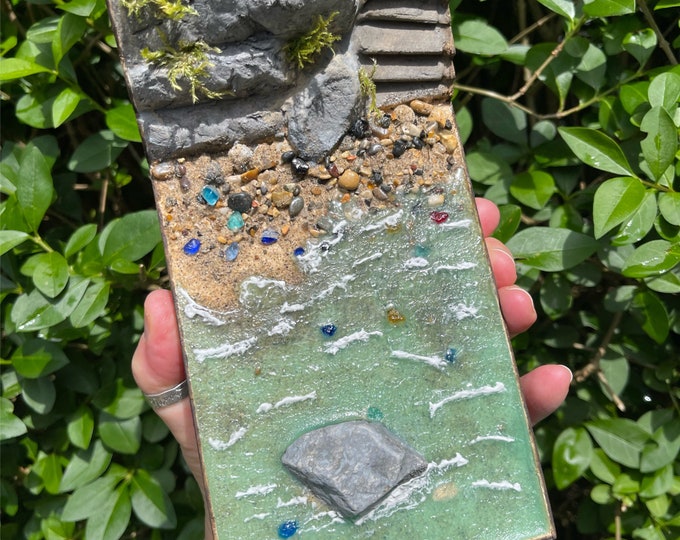 Sea Glass Beach. Genuine Sea Glass on real beach sand with pebbles on handmade Diorma Scenery. Multi Media Resin Art. World Ocean Day 2024.