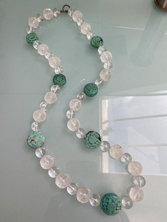 Carved turquoise and quartz necklace with carved g
