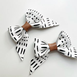 Black & White leather bow,soft nylon headband or clip, original and petite size, fits newborn to adult. Different styles in listing