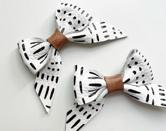 Black & White leather bow,soft nylon headband or clip, original and petite size, fits newborn to adult. Different styles in listing