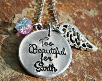 Too Beautiful For Earth hand stamped necklace with pewter angel wing and blue pink bead