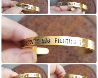 Sometimes the smallest bodies are fighting the biggest battles stainless steel hand stamped bangle bracelet