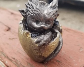 Pure pewter dragon emerging from egg sculpt