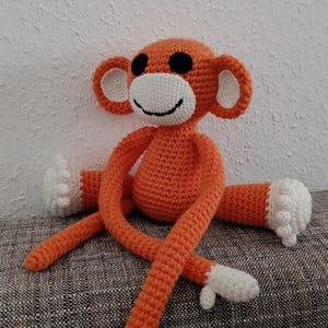 Cuddly toy Amigurumi monkey in orange (1 copy is crocheted and ready to ship)
