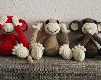 Cuddly toy Amigurumi monkey in red