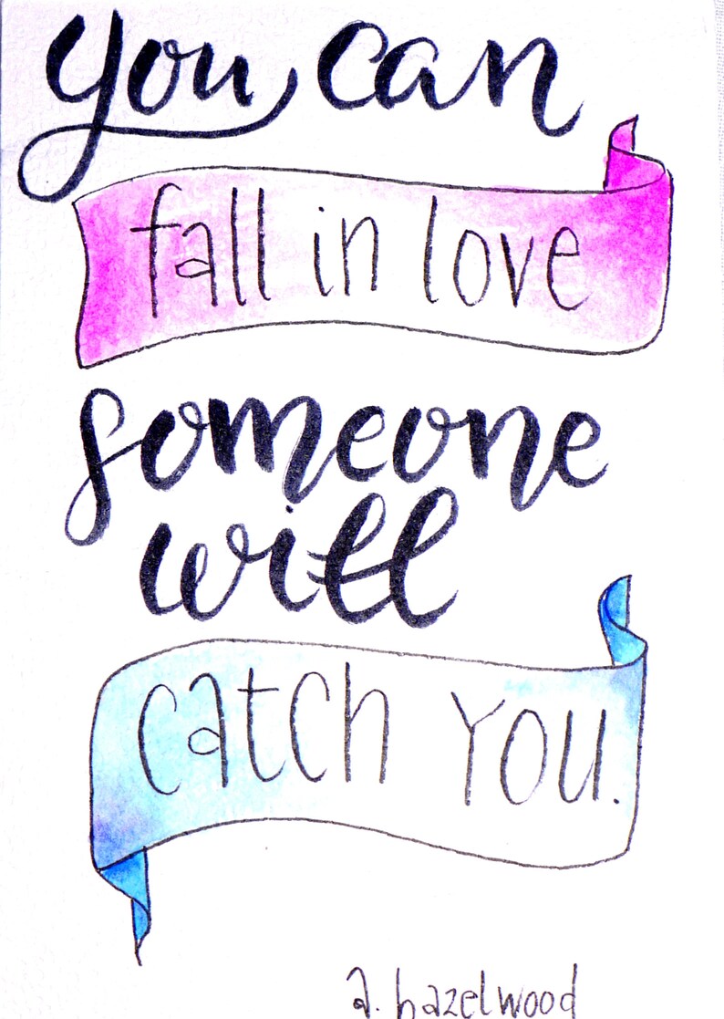 May include: Hand-lettered quote in black ink on a white background with two banners. The top banner is pink and says 'fall in love'. The bottom banner is blue and says 'someone will catch you.' The quote is signed 'a. hazelwood'.