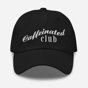 May include: Black baseball cap with white embroidered text that reads "caffeinated club".