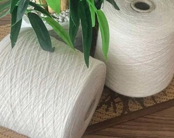 100% merino extrafine Lanecardate (Canberra) yarn on Cone, hand and machine knitting, Italian bobbin yarn, White color.