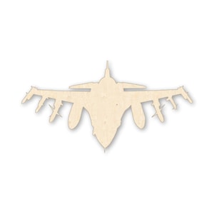 May include: A wooden cutout of a fighter jet, viewed from above. The plane is light brown with detailed wing and tail structures. The design includes multiple missiles attached to the wings, and a pointed nose.