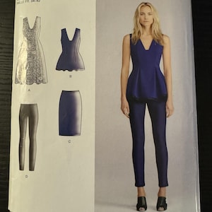 May include: A Simplicity sewing pattern featuring designs by Cynthia Rowley. The pattern includes a dress, top, skirt, and pants. The model is wearing a blue top and pants. The pattern size is U.S. 6-14.