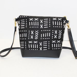 Mudcloth print small crossbody with adjustable faux leather strap, zip closure and, inside pocket