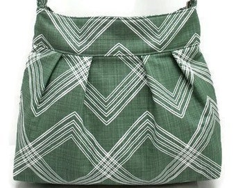 Green canvas zipper crossbody bag with inside pockets for everyday use, adjustable strap