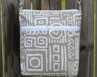 Canvas fabric crossbody bag with double zipper closure and adjustable straps , Pockets inside