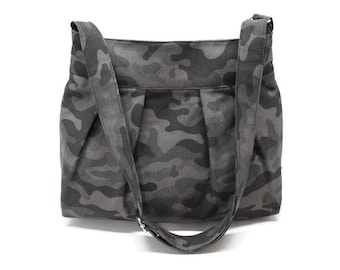Camouflage canvas fabric crossbody bag with zipper closure and adjustable strap and inside pockets