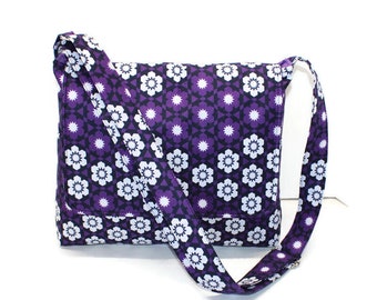 Purple fabric messenger crossbody bag with adjustable strap and pockets