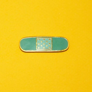 Bandage - Hard enamel lapel pin