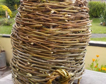 Alveary bee-hive, primitive design, woven willow (wicker) and hazel (pre Anglo Saxon style), traditional, beekeeping, gardens, outdoors