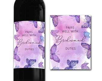 May include: Purple and blue watercolor wine bottle label with butterflies and the text "Pairs well with Bridesmaid Duties".