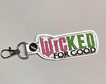 Porte-clés du film Wicked For Good - Charm brodé rose et vert