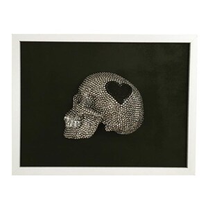 May include: A white framed black and white photograph of a silver skull with a black heart on the forehead.