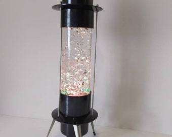 Vintage jaren 70 glitter lavalamp zwart bakeliet kinetische bureaulamp