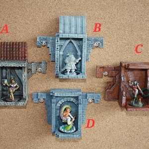 May include: Four miniature wall-mounted display cases with figures inside. The cases are made of painted plaster and have a variety of architectural styles. The figures are painted in bright colors and are posed in dramatic positions.