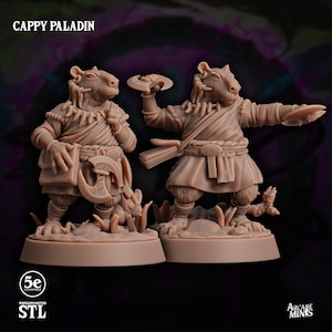 May include: Two 3D printed miniature figures of a Cappy Paladin, a humanoid creature with a capybara head, wearing a robe and holding a weapon and a book. The figures are printed in a light brown color and are posed in different stances. The text "Cappy Paladin" is visible at the top of the image.