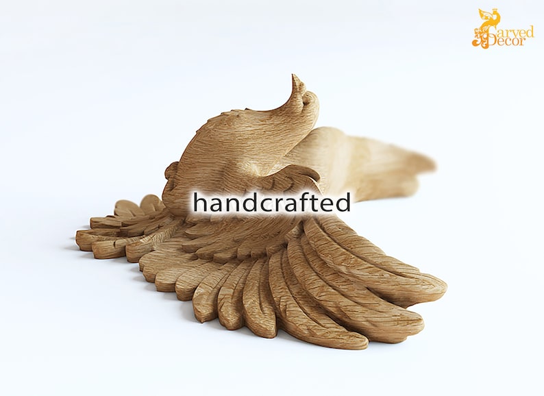 May include: A handcrafted wooden sculpture of a bird in flight, with outstretched wings. The sculpture is made of light-colored wood and features detailed carving of feathers and body. The word "handcrafted" is displayed on the sculpture.