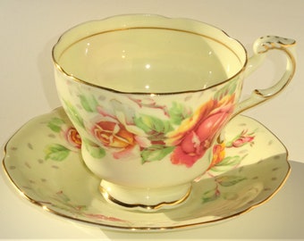 Paragon England GOLDEN EMBLEM Tea Cup and Saucer w/ Creamy Yellow Ground