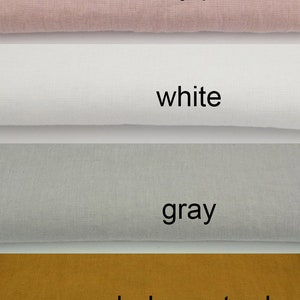May include: Four fabric swatches in different colors: dusty pink, white, gray, and dark mustard.