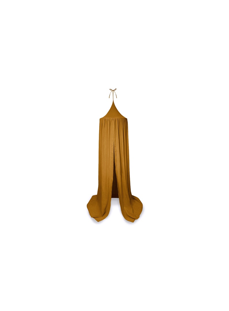 May include: Mustard-coloured canopy with a conical top and flowing fabric. The canopy is suspended from a single point, with a tie at the top. The fabric drapes down, creating a soft, inviting space. Suitable for a child's bedroom or play area.