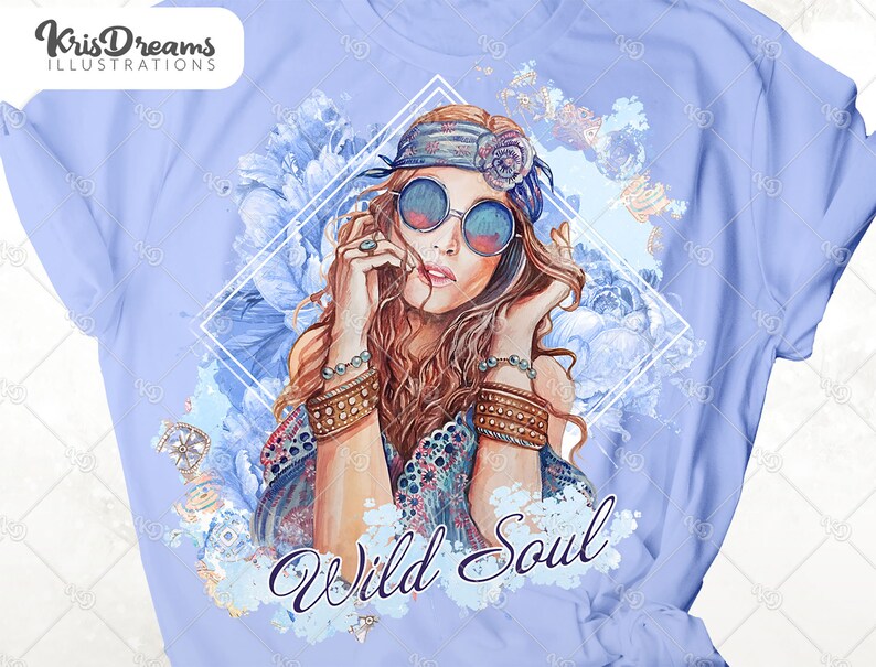 May include: A light blue t-shirt with a watercolor design of a woman with long brown hair wearing a headband and sunglasses. The design includes flowers and the text "Wild Soul".