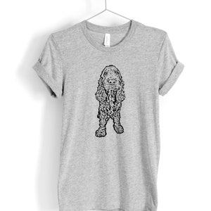 May include: A gray t-shirt with a black and white illustration of a Cocker Spaniel dog.