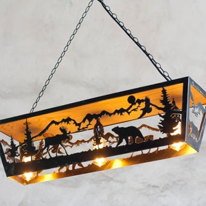 Rustic cabin light fixture. Moose and Bear pendant light. Three light ceiling lights.