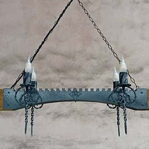 Chandelier lights. Wrought iron lighting fixture. Rustic castle style lamp