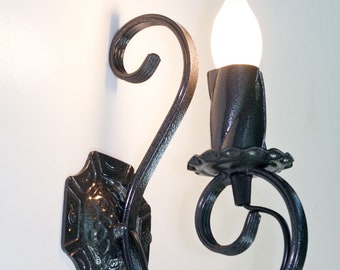 Wrought iron wall light. Wall sconce. Candelabra sconce