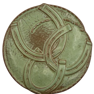 May include: A rustic wooden sign with the text "Welcome to our home" in white lettering. The sign features a distressed finish and a simple, inviting design, perfect for entryway decor.