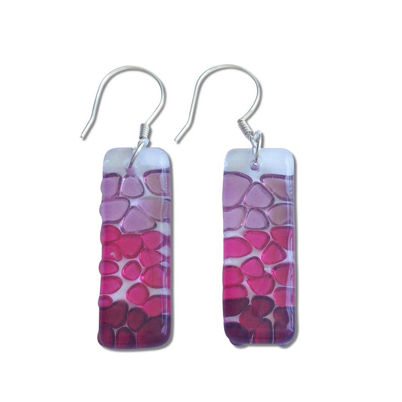 May include: A pair of silver dangle earrings with rectangular pink and purple glass mosaic designs.