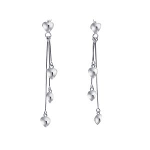 May include: Silver dangle earrings with three heart-shaped charms on each earring.