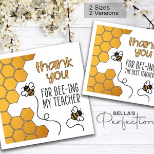 May include: Two printable thank you cards for teachers featuring a honeycomb pattern and a bee. The text on the cards reads "Thank you for bee-ing my teacher" and "Thank you for bee-ing the best teacher".