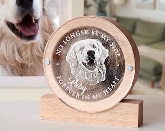 May include: A framed photograph of a Golden Retriever next to a wooden memorial. The memorial is a round, clear acrylic piece with a laser-etched image of a dog and the words "NO LONGER BY MY SIDE FOREVER IN MY HEART" and the name "Ruby".