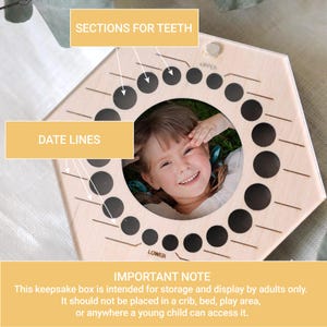 May include: A hexagonal light-coloured wooden keepsake box featuring a circular centre cutout for a photograph. The frame includes twenty small circular holes labelled UPPER and LOWER for teeth storage, with etched date lines next to each hole.