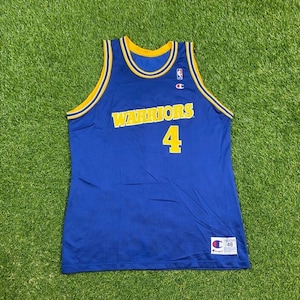 May include: A blue basketball jersey with yellow trim and the word "WARRIORS" in yellow lettering. The number "4" is on the front of the jersey in yellow. The jersey is made by Champion.