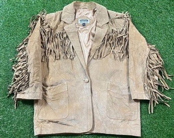 May include: A brown suede jacket with fringe detailing. The jacket has a button closure and two pockets. The label on the jacket reads "Fashion Classics".