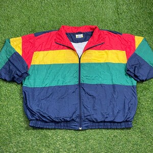 May include: A multi-colored nylon jacket with a zipper closure. The jacket has stripes of red, yellow, green, and blue.