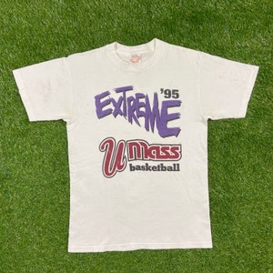 May include: White t-shirt with a purple and white graphic that says "Extreme '95 UMass Basketball".