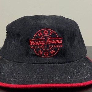 May include: Black baseball cap with a red embroidered logo that says "Hot Krispy Kreme Original Glazed Now".