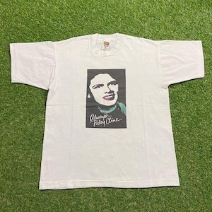 May include: White t-shirt featuring a black and white portrait of Patsy Cline with the text "Always... Patsy Cline." The shirt is made of a soft material and has short sleeves.