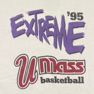 May include: White t-shirt with purple text that says "EXTREME '95" and red text that says "UMass basketball".